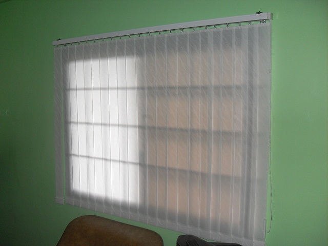 Fabric vertical blinds generating filtered lights